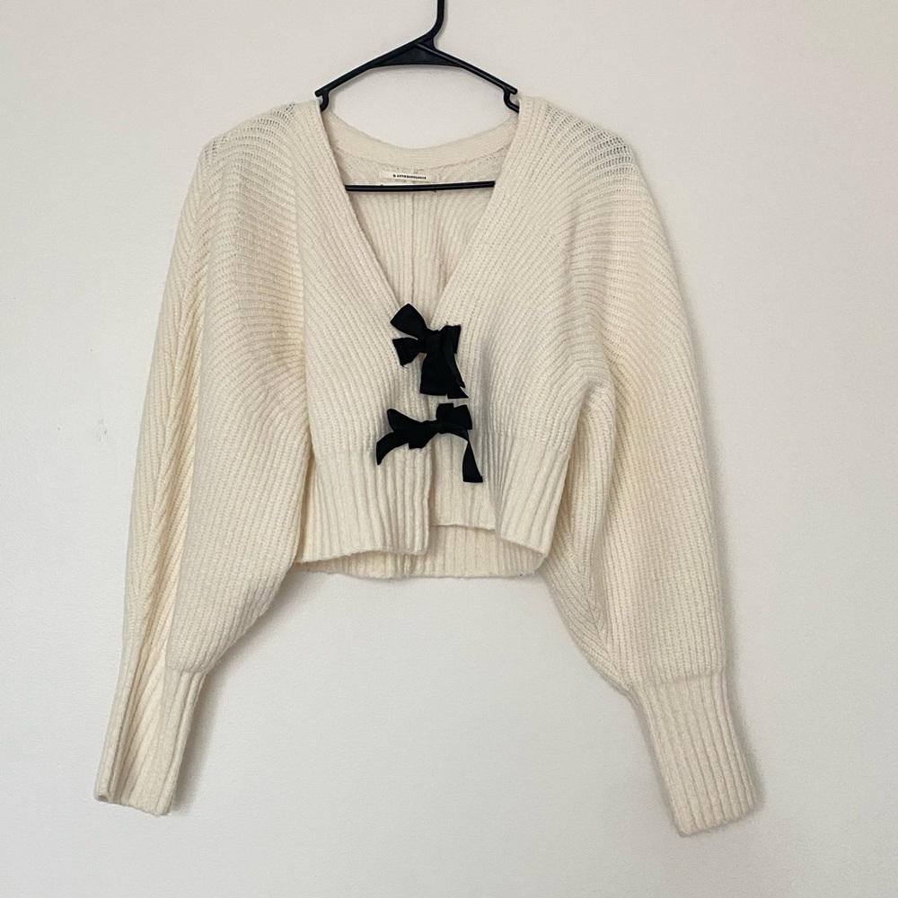 Cream Sweater with Black Bow Accents